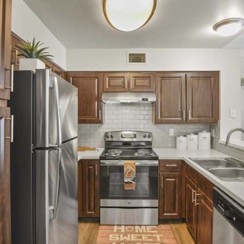 Kitchen with stainless-steel appliances at Walker Landing in Aurora, Colorado