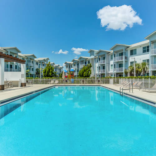 Pool area with lounge chair at Palm Beach Preserve in West Palm Beach, Florida  
