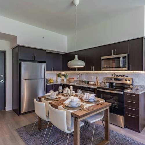 Kitchen with wooden flooring at Palm Beach Preserve in West Palm Beach, Florida 