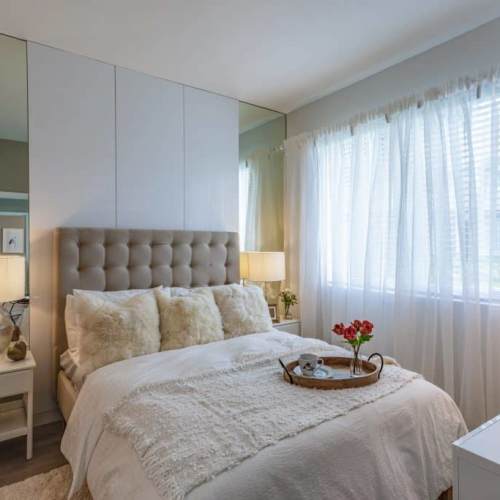 Cozy bedroom with window at Palm Beach Preserve in West Palm Beach, Florida