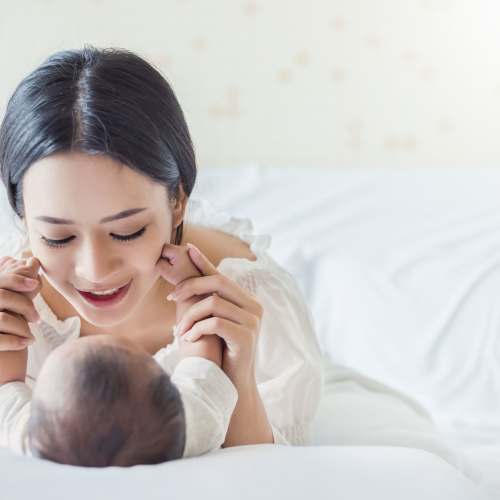 Happy mother playing with her baby at Kings Gate Apartments / King James Apartments in Vancouver, Washington