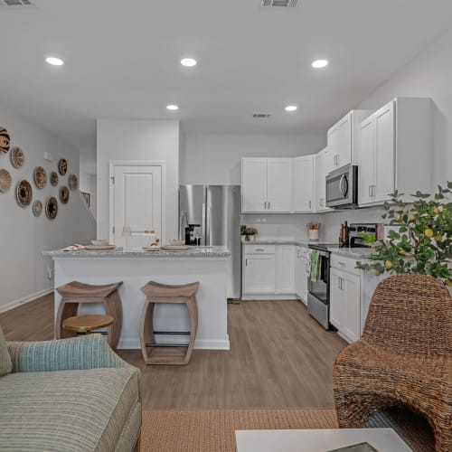An apartment kitchen with an island and pantry at Artisan Living North Beach in Santa Rosa Beach, Florida