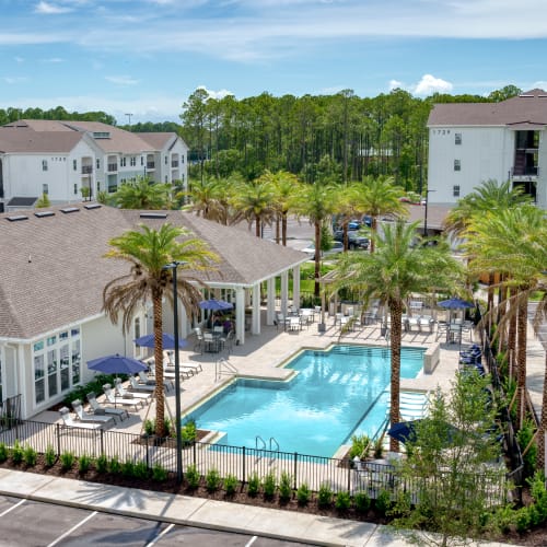 Aerial view of our swimming pool and outdoor lounge chairs at The Station at Fleming Island in Fleming Island, Florida