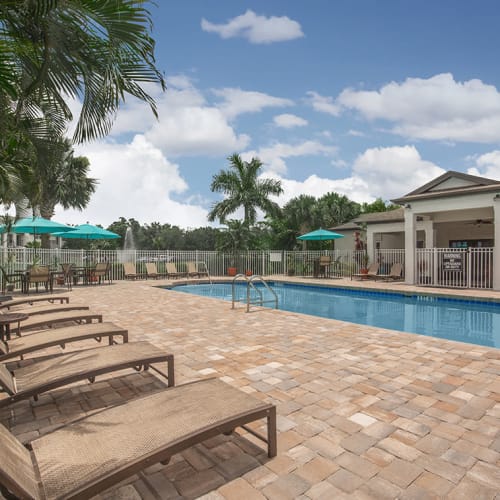 Lounge seating facing the community pool at Vero Green in Vero Beach, Florida