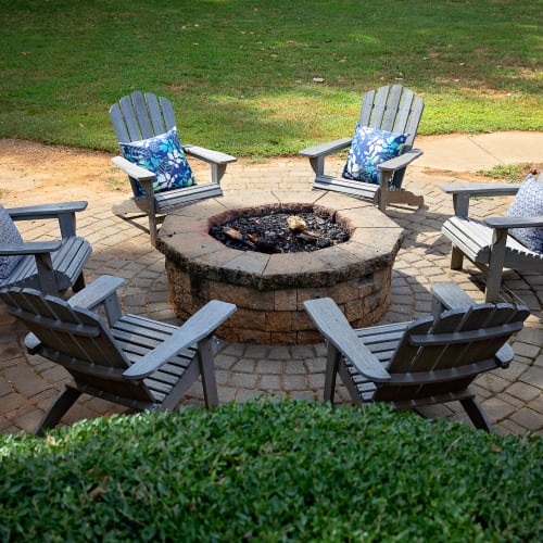 Seating around a firepit at Dwell at Carmel in Charlotte, North Carolina