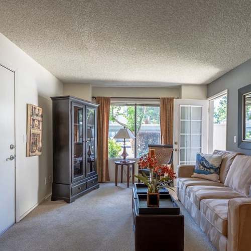 Living room with huge windows at Ashford Park in Sacramento, California