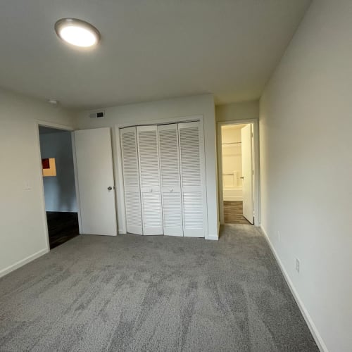 Carpeted bedroom at Foxcreek Apartments in Winston Salem, North Carolina