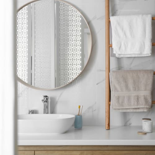 Bathroom with mirror at Housing Hilltop in Tacoma, Washington