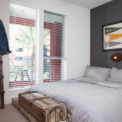 Spacious bedroom with a comfortable bed at The Marke Apartment Homes in Santa Ana,