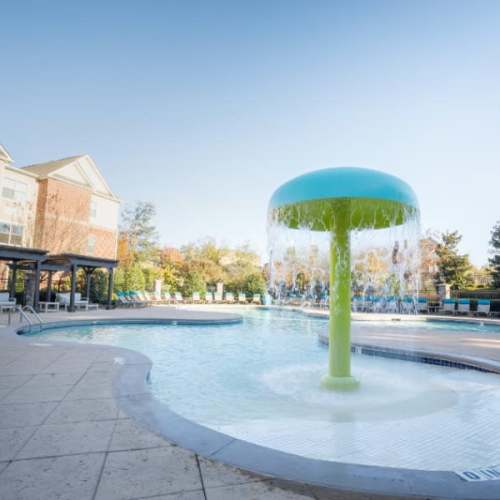 Swimming pool and splash pad at The Asher at Sugarloaf in Lawrenceville, Georgia