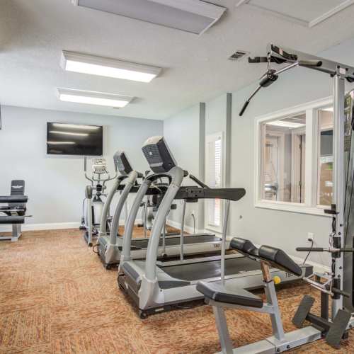 Fitness center at Flats At Riverview in Duluth, Georgia