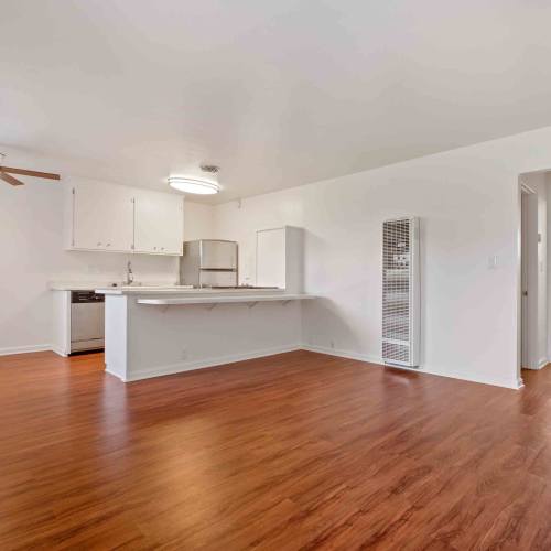Wood-style flooring in an apartment living room at Lorenzo Commons in San Lorenzo, California