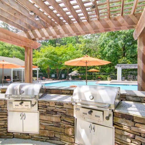 Grills by the pool at Place at Midway in Douglasville, Georgia