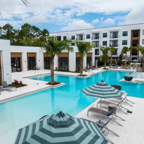 Relax and lounge by our zero-entry swimming pool at The Residences at Enso in Jacksonville, Florida