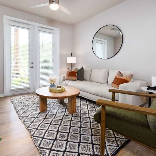 Living room with ceiling fan at The Residences at Enso in Jacksonville, Florida