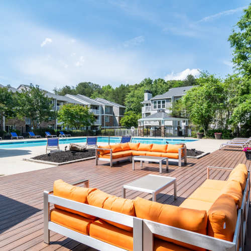 Lounge area by the swimming pool at 2200 Big Creek Apartments in Roswell, Georgia