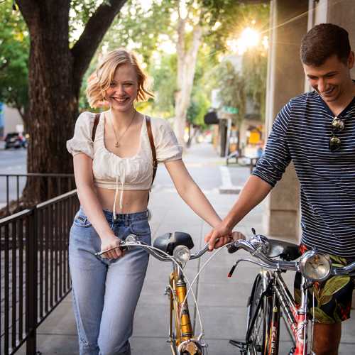 Residents walking their bikes near 1801L Apartments in Sacramento, California