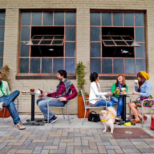 Outdoor cafe tables near 1801L Apartments in Sacramento, California