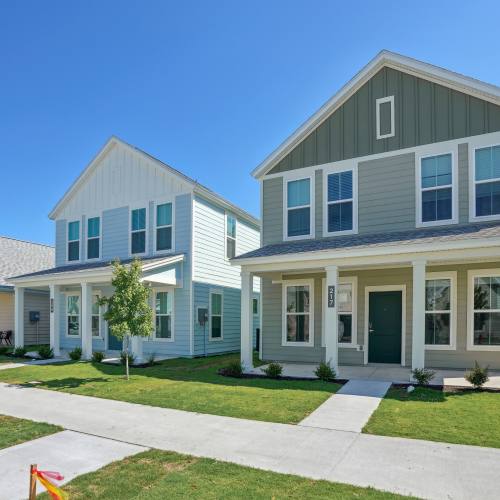 Spacious island kitchen, dishwasher, and wood floors at Hamlet at Wildlight in Yulee, Florida