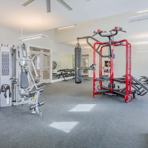 Weightlifting equipment in the fitness center at Reserve at River Place in Youngsville, Louisiana