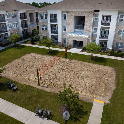 Aerial view of the sand volleyball court at Reserve at River Place in Youngsville, Louisiana