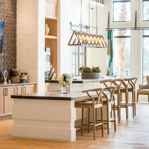 Community clubhouse with bar seating at The Heyward in Charleston, South Carolina
