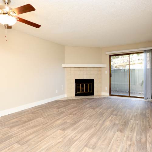 Living room with fireplace  at Ellington Apartments in Davis, California