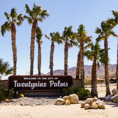 a resident with her shopping bags at Sunflower Terrace in Twentynine Palms, California