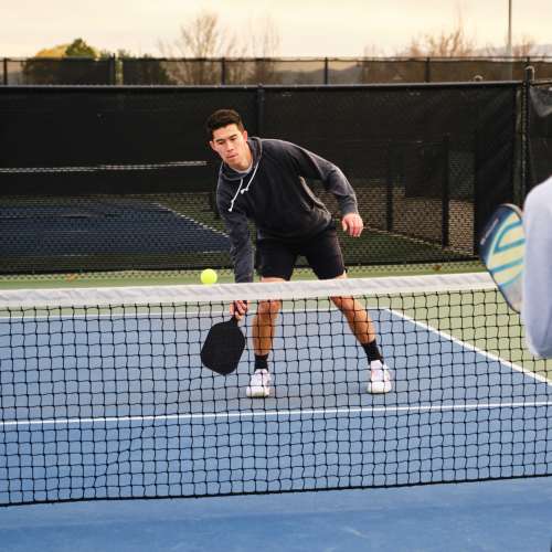 A resident playing pickle ball at Ascent Apartment Homes in Asheville, North Carolina