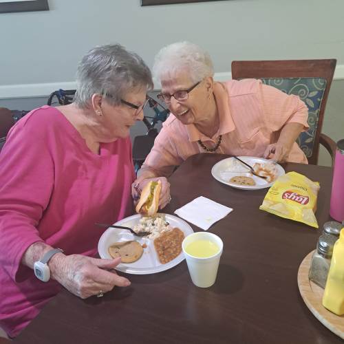 Smiling caregiver during Christmas at Saunders House in Wahoo, Nebraska