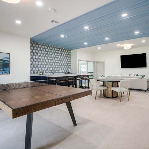 Inside clubhouse with ping pong table and seating at The Marley at Trout River in Jacksonville, Florida
