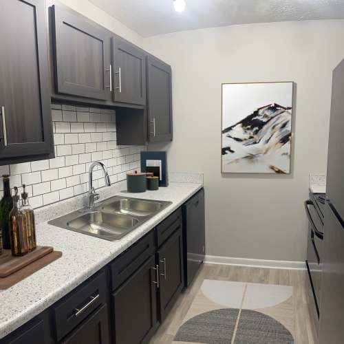 Kitchen with hardwood flooring at Candlewood Apartment Homes in Nashville, Tennessee