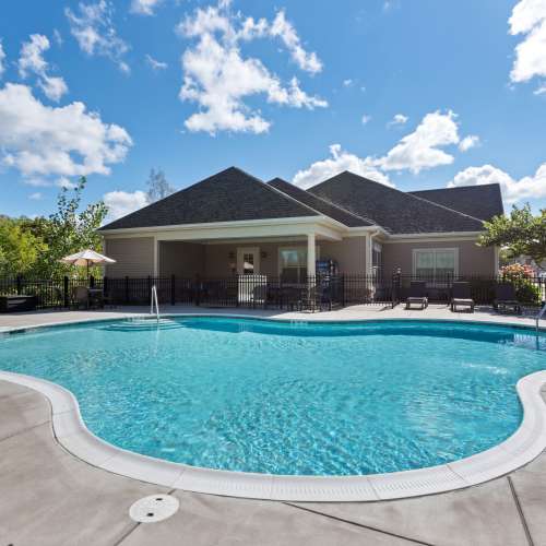Swimming pool and sundeck at Auburn Creek Apartments in Victor, New York