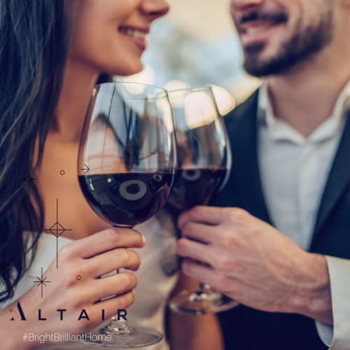 Resident couple drinking wine at O'Fallon, Missouri near Altair At The Preserve