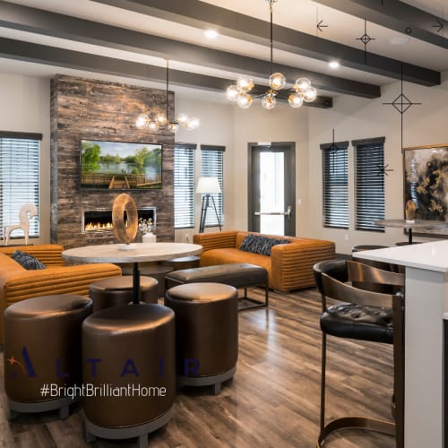 Clubhouse with lavish hardwood flooring at Altair At The Preserve in O'Fallon, Missouri