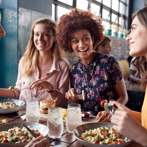 Resident eating in restaurant near Crossings At NoDa in Charlotte, North Carolina 