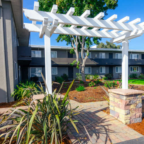 Swimming pool and sundeck at Garden Court Apartments in Alameda, California