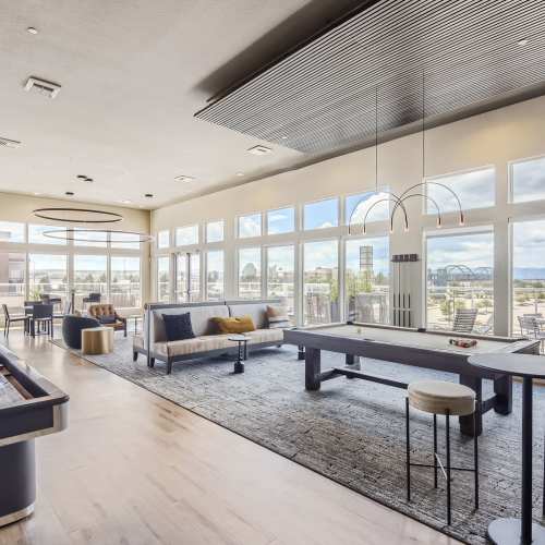 Pool table and comfortable seating in the clubhouse at Elevation @ County Line Station in Englewood, Colorado