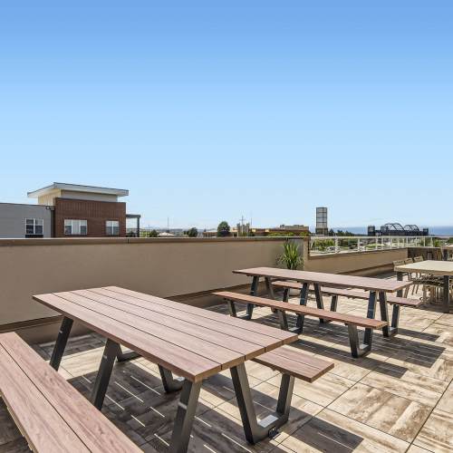 Picnic tables on the roof deck at Elevation @ County Line Station in Englewood, Colorado