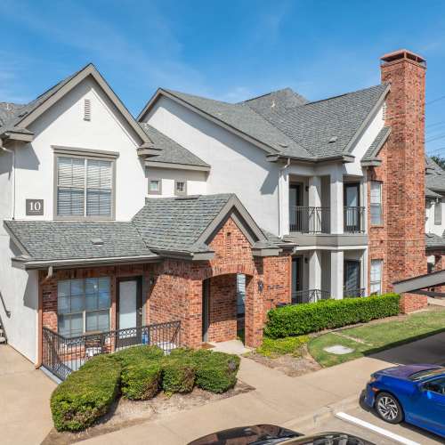 Townhomes with neat landscaping at The Livingston in Plano, Texas