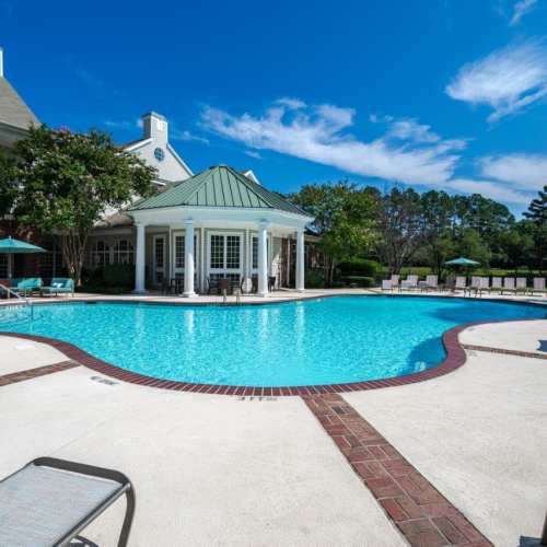 Swimming pool and sundeck patio seating at The Preserve at Grande Oaks in Fayetteville, North Carolina