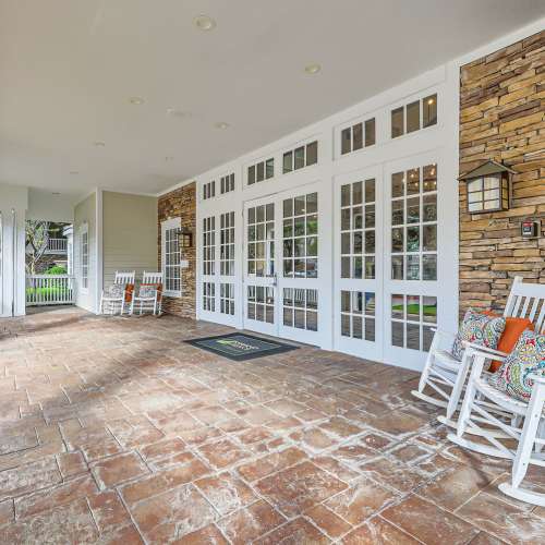 Rocking chairs outside the leasing office at Republic House at Frisco Bridges in Frisco, Texas