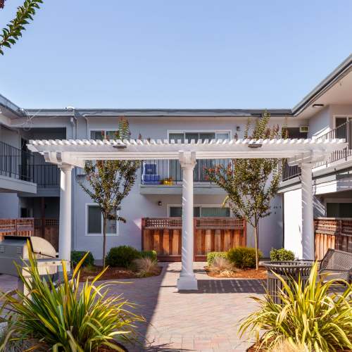 Outdoor BBQ and picnic area outside of Marina Haven Apartments in San Leandro, California