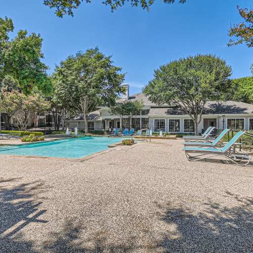 Lounge chairs by the pool at Wildwood Creek in Grapevine, Texas