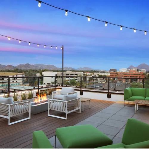 Community seating area with firepit at Art on Highland in Phoenix, Arizona