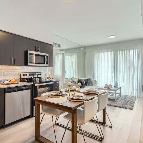 Kitchen and dining area of Amelia Apartments in Miami, Florida