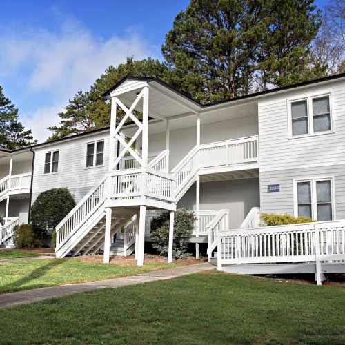 View of exterior of building and green lawn at Edge at Concord in Concord, North Carolina, 