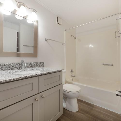 Bathroom with granite like countertop at The Flats at Lakeshore in Fort Oglethorpe, Georgia