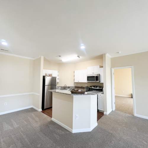 Open-concept kitchen with breakfast bar at Village at Lake Wylie in Lake Wylie, South Carolina
