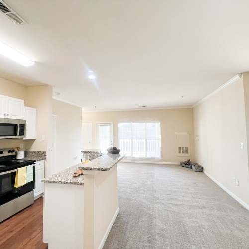 Kitchen and dining area with view into the living room at Village at Lake Wylie in Lake Wylie, South Carolina
